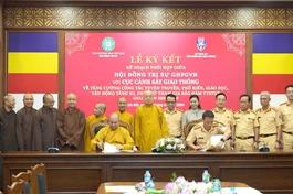  hượng tọa Thích Đức Thiện thay mặt Hội đồng Trị sự GHPGVN và Đại tá Phạm Quang Huy thay mặt Cục Cảnh sát Giao thông tiến hành ký kết kế hoạch phối hợp giai đoạn mới 2026-2030