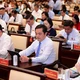 Các đại biểu HĐND TP.HCM biểu quyết thông qua các nghị quyết tại kỳ họp - Ảnh: Quang Định