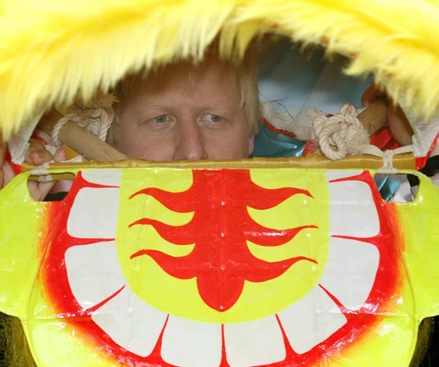Mayor of London Boris Johnson wears a Chinese dragon costume at a photocall in Chinatown to promote the capital’s Chinese New Year celebrations
