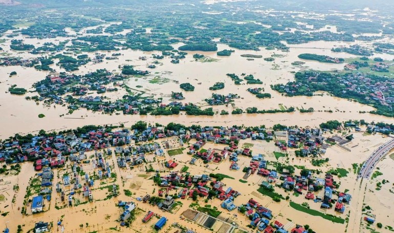 Lũ sông Cầu dâng cao gây ngập lụt nhiều phường ở Thái Nguyên - Ảnh: Lê Duy Khắc